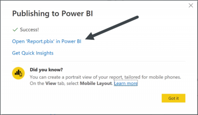 Message box announcing successful publishing of the report to Power BI. Arrow pointing to the "Open 'Report.pbix' in Power BI" link.